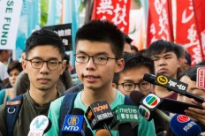 Joshua Wong leads 'anti-authoritarian' march in Hong Kong