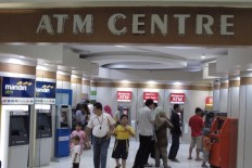 Central bank cuts merchant discount rates for debit card transactions