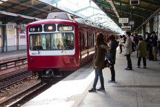 Tokyo subway test aims to let pregnant women secure seats via chat app
