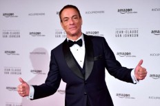 Belgian actor Jean-Claude Van Damme poses during a photocall for the world launch of the Amazon Prime series 'Jean-Claude Van Johnson' on December 12, 2017, at the Grand Rex theatre in Paris. 