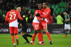 Monaco hit four to stay in PSG chase