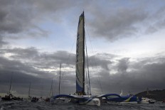  Frenchman breaks new record for sailing solo around the world  