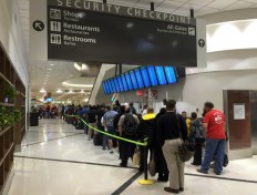 This file photo taken on May 17, 2016 shows passengers as thry wait to go through security at the north terminal of the Hartsfield–Jackson Atlanta International Airport in Atlanta, Georgia. 