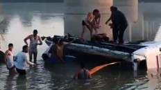 At least 32 dead as bus plunges off bridge in India