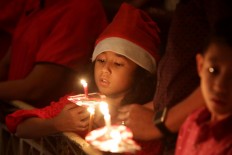 Light of hope: Christians celebrate Christmas at Immanuel church in Jakarta. JP/Wendra Ajistyatama