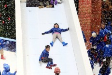 Slide: Children play at Snow Playland in Ciputra Mall, West Jakarta, on Monday. The mall introduced a snow themed playground to lure more visitors during this year's Christmas celebrations. JP/Dhoni Setiawan