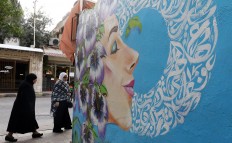 A picture taken on December 18, 2017 shows a graffiti mural on a wall in the Jordanian capital Amman. A tiny group of graffiti artists are on a mission -- daubing flowers, faces and patterns across the capital Amman to bring more colour to the lives of its four million inhabitants.
In a conservative society like Jordan's, the graffiti artists have constantly had to challenge convention to carve out a niche for their works, though still with limits as they steer away from politics and religion. AFP/Khalil Mazraawi 