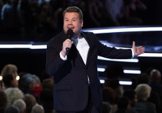 Corden gives 'consolation puppies' to Grammy losers
