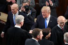 Trump calls for unity after contentious first year