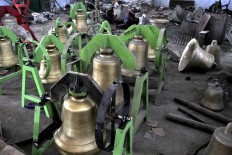 Church bells in different sizes are displayed and ready for delivery to customers. JP/Magnus Hendratmo