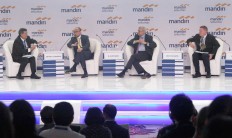 Mandiri Institute Advisory Board chairman M. Chatib Basri (second left), Bank Mandiri chief economist Anton Gunawan (left), Mandiri Institute Advisory Board member Bejoy Das Gupta (second right) and Jefferies global strategist Sean Darby participate in a panel discussion during the Mandiri Investment Forum (MIF) on Feb. 7 in Jakarta. 