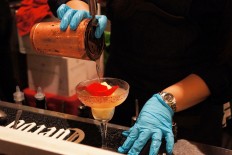 A bartender concocts a Frozita Margarita.
