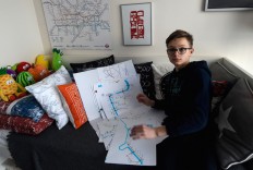 Matej Hosek, a Czech schoolboy with Asperger syndrom, shows a map that he designed, on January 29, 2018, in his bedroom in the village of Cernosice, Czech Republic. Diagnosed with severe Asperger syndrome, the 13-year-old bespectacled boy has found peace and order in sophisticated maps of his own making. Not only that -- they have also turned him into a fashion designer of sorts.