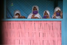 The students even wear surgical masks during school breaks. JP/Maksum Nur Fauzan