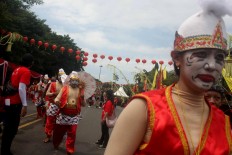 Parade participants wear Punokawan costumes. Punokawan is a quartet of clown servants of the hero in Javanese wayang (puppet) taken from the Mahabharata epic. JP/Maksum Nur Fauzan