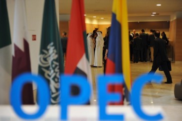 Participants gather in the lobby ahead of an informal meeting between members of the Organization of Petroleum Exporting Countries, OPEC, in the Algerian capital Algiers, on Sept. 28, 2016. 