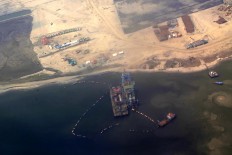 Reclamation activities take place in June 2015 in the Jakarta Bay related to the Giant Sea Wall project.