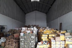 Stacks of expired food products are seen at a warehouse of PT Pandawa Rezeki Semesta in West Jakarta on March 21, 2018.
