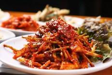 Raw skate mix with seasoning. fresh or vinegar-pickled skate sliced and mixed with radish, asian pear, and korean parsley in a spicy gochujang-vinegar sauce.