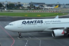 Qantas raises $940 million to counter coronavirus, shares slip