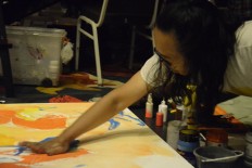 Indonesian artists paint in the dark during Earth Hour