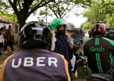 As Uber bows out to Grab, drivers and riders bemoan loss of choice