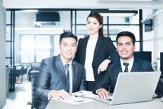 Illustration of young employees, as JPMorgan Chase & Co. is hiring more engineering, neuroscience and psychology graduates across Asia-Pacific.