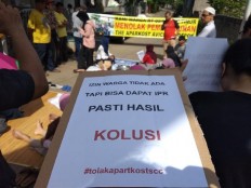 Depok residents block road in protest against apartment construction