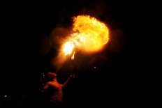 Pramono shows off his fire-breathing skills during the festival. JP/Magnus Hendratmo