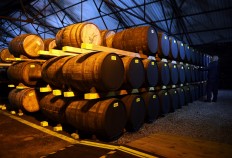 Employee Nigel Baker works in one of the distillery warehouses where the oak barrels of whisky can be stored for up to 25 years before bottling, at the Auchentoshan Distillery near Glasgow, Scotland on February 28, 2018. Demand for more variety in Scotch whisky from fast-growing emerging markets and the request for lower alcohol varieties among health-conscious drinkers are challenging a closely guarded centuries-old tradition.