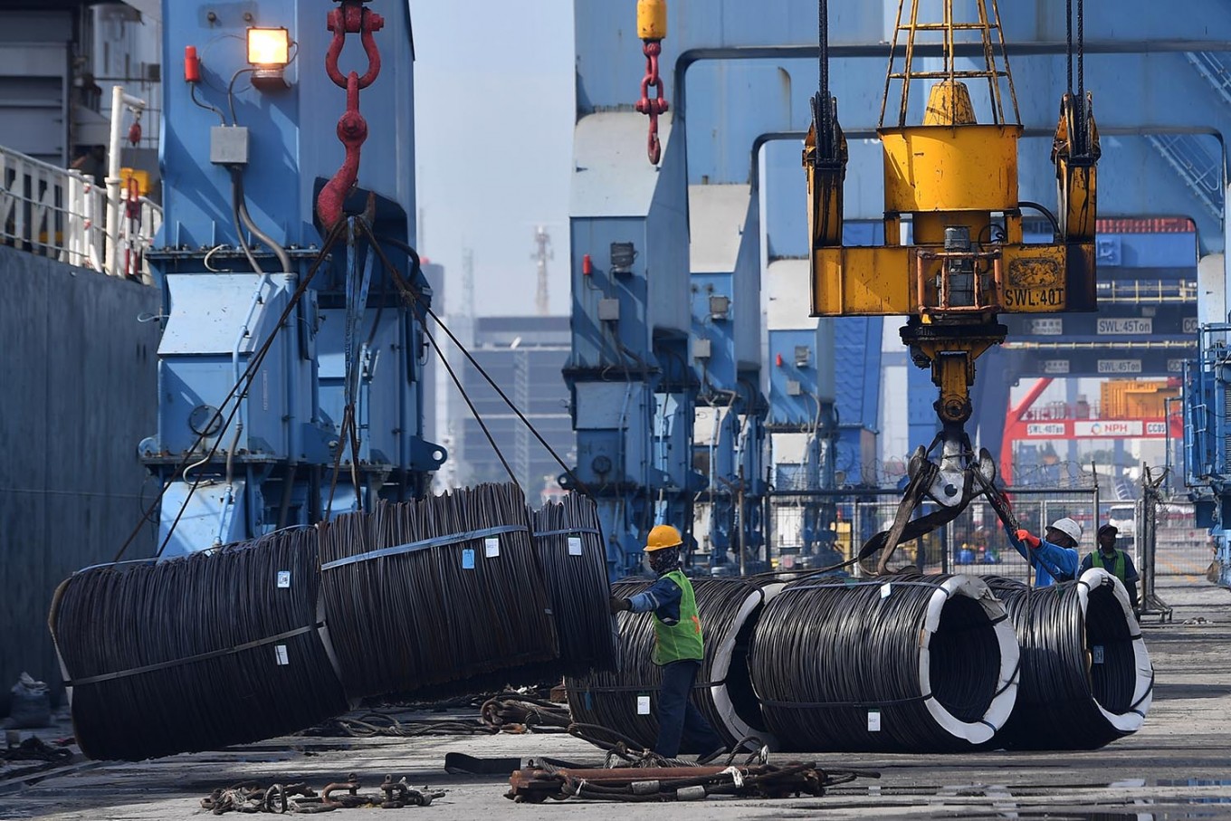 Steel rolls are unloaded at Tanjung Priok Port in North Jakarta on April 4. 