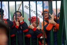 Workers rally to demand social security and universal health coverage in 2010.