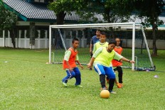 Students play soccer for the StarCoach project at Global Jaya School in South Tangerang, Banten, on, April 15.
