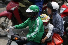 Watchdog probes Grab's Uber buy in Vietnam