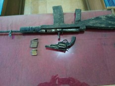TNI confiscates weapons from Poso resident