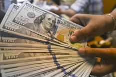 Rupiah hits two-year high, but concern grows over impact on  exports