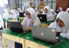 Students in Indonesia's disaster-hit areas get easier questions in national exams
