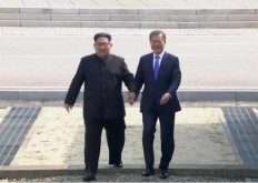 North Korea says may reconsider summit with Trump, suspends talks with South