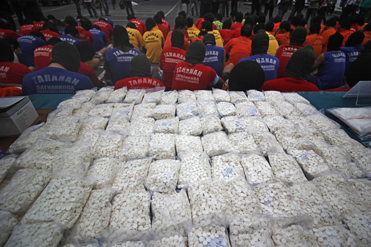 Busted: The Surabaya Police display narcotics and drugs, as well as drug suspects, during a press conference on the progress of the 2018 Semeru anti-drug operation at the Surabaya Police headquarters in Surabaya, East Java, on April 26. 