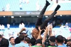 City lift Premier League trophy as Huddersfield gain precious point