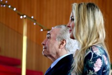 Brazil's first lady mocked after jumping in lake to rescue dog