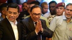 Selfies with his captors: a whirlwind day for Anwar Ibrahim