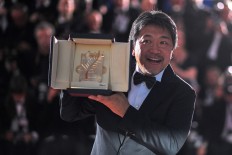 Japan wins Cannes top prize after Weinstein accuser takes stage