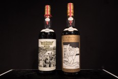 Two bottles of whisky, Macallan Peter Blake 1926 (L) and Valerio Adami 1926 (R), are displayed ahead of a Bonhams auction in Hong Kong on May 18, 2018. 