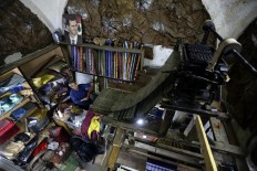 On a Damascus rooftop, tinting silk a fading craft