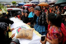 Mourners bury young Guatemalan woman killed by US border agent