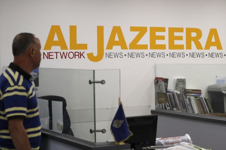Employees of Qatar based news network and TV channel Al-Jazeera are seen at their Jerusalem office on July 31, 2017, Israel said on August 6, 2017 that it planned to close the offices of Al-Jazeera after Prime Minister Benjamin Netanyahu accused the Arab satellite news broadcaster of incitement.