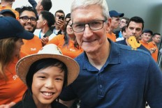 Indonesian boy Yuma Soerianto is photographed with Apple CEO Tim Cook at the Worldwide Developer Conference (WWDC 2018) held by Apple at San Jose, California, on Sunday.
