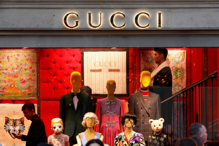 is gucci owned by lvmh