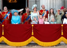 Britain's Queen Elizabeth, Prince Charles, Prince Harry and Meghan, Duchess of Sussex, Prince William and Catherine, Duchess of Cambridge, along with other members of the British royal family, look up at the RAF flypast from the balcony of Buckingham Palace as part of Trooping the Colour parade in central London, Britain, June 9
